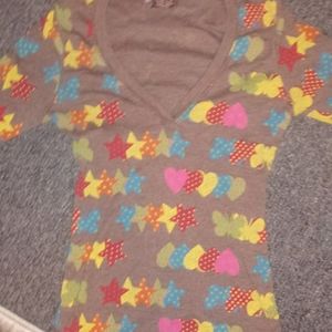 Girls brown shirt with butterflies, hearts, stars.